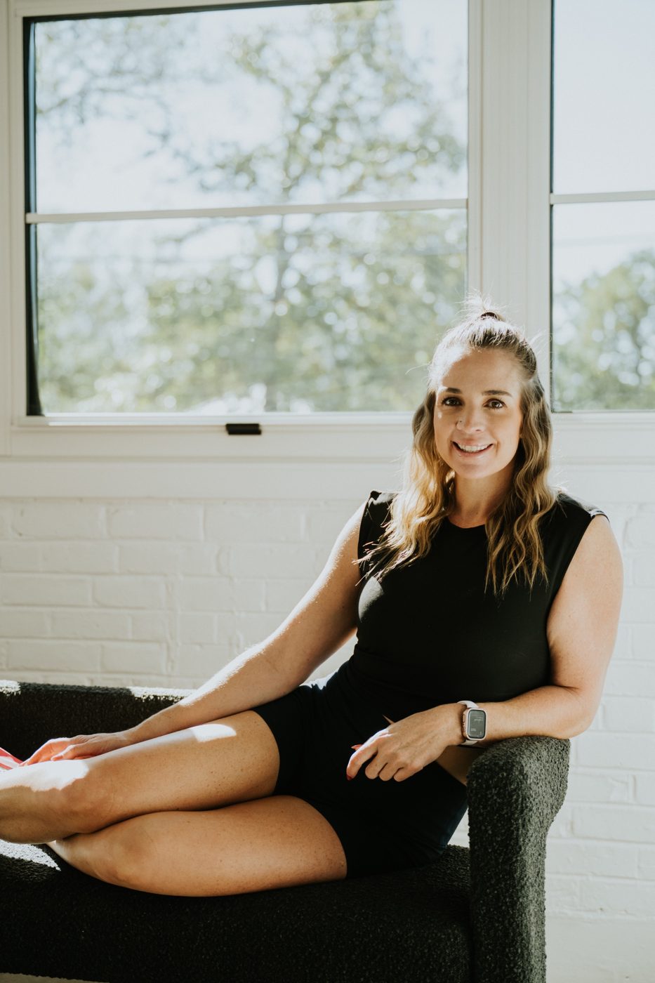 Meg Weatherman smiling in a bright studio